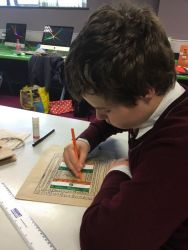 Alex designs an Indian bag.